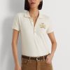 Crem Tricouri polo Ralph Lauren pentru femei cu crest din piqué Crem Tricouri polo Ralph Lauren pentru femei cu crest din piqué