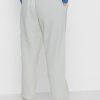 Pantaloni de sport Ralph Lauren cu dungi laterale de damă bej Pantaloni de sport Ralph Lauren cu dungi laterale de damă bej